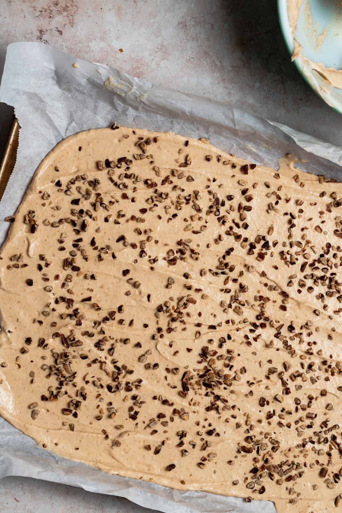 The walnut pieces are sprinkled on top of the yogurt bark.