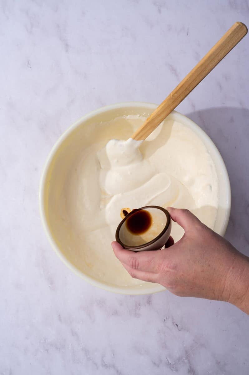 The vanilla extract are added to the bowl.
