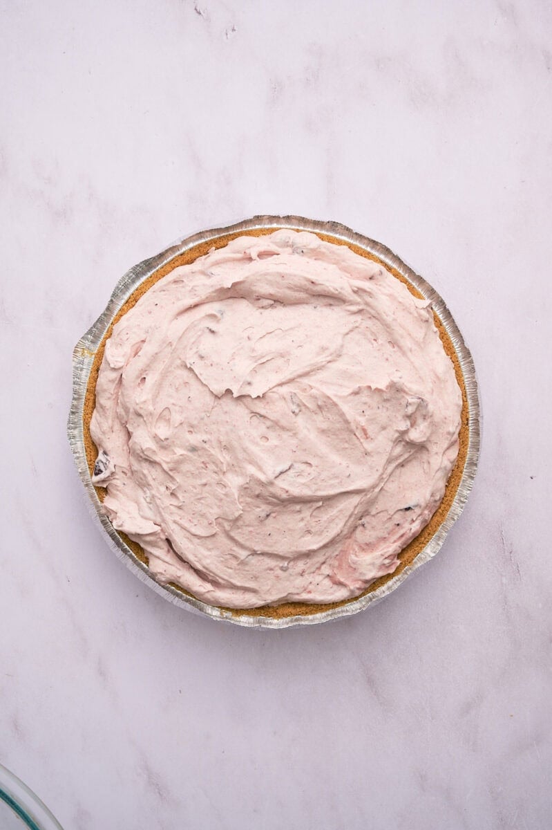 The filling is added to the pie crust.