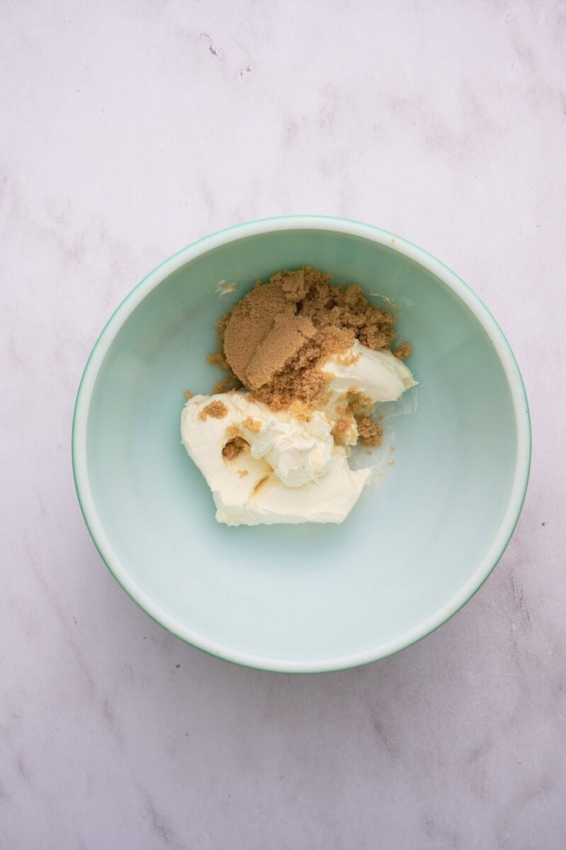 The brown sugar and cream cheese are in a bowl.