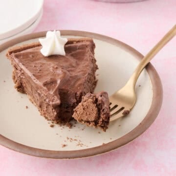 A slice of the no bake chocolate pie has a piece of the pie on a fork.