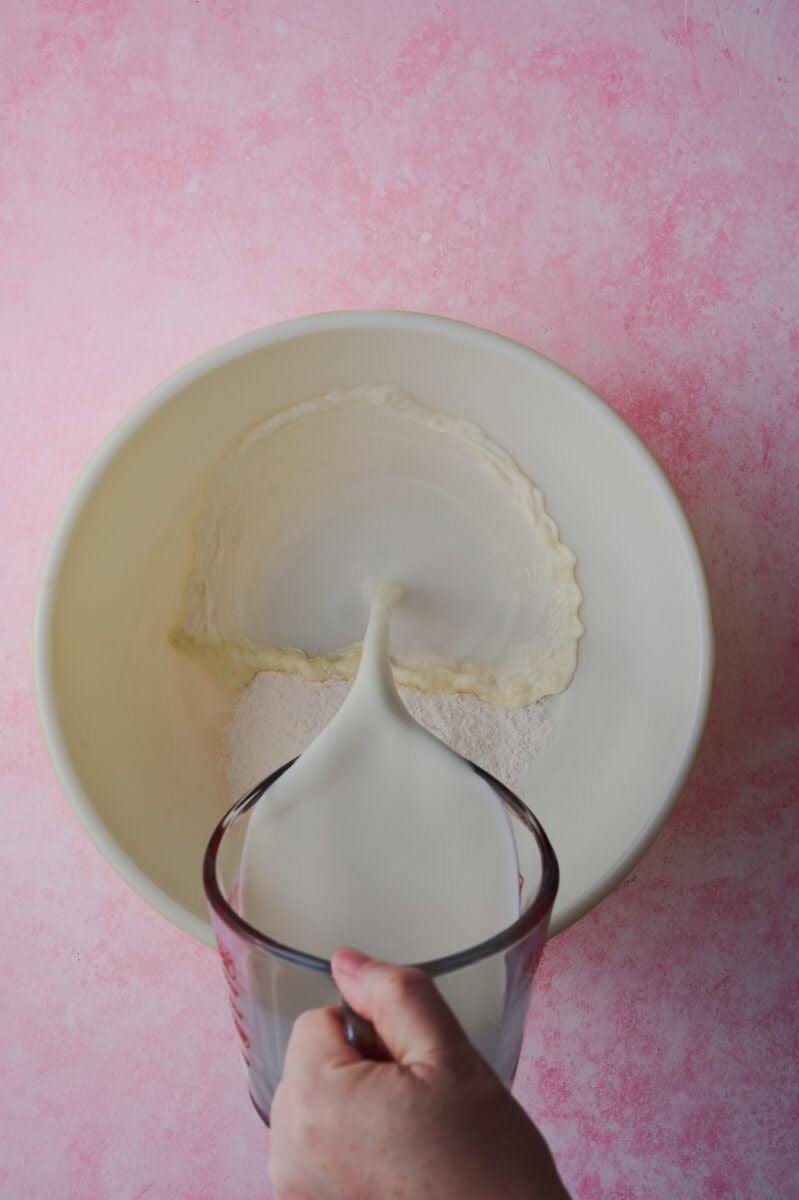 The pudding is being made in a large mixing bowl.